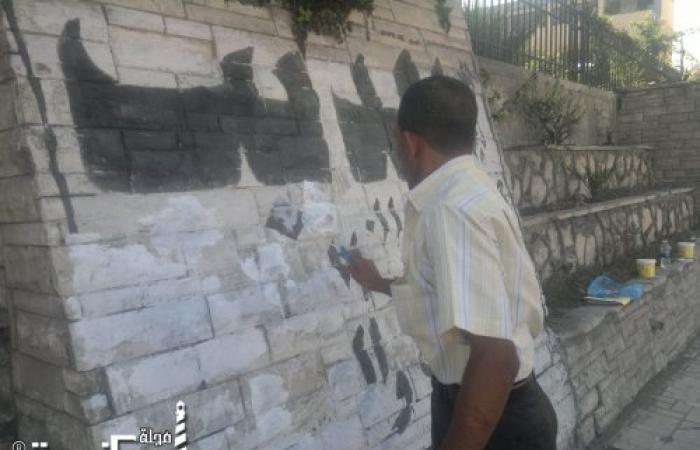 إزالة الإعلانات المخالفة المكتوبة فوق حوائط الشوارع والميادين في نطاق حي وسط الإسكندرية
